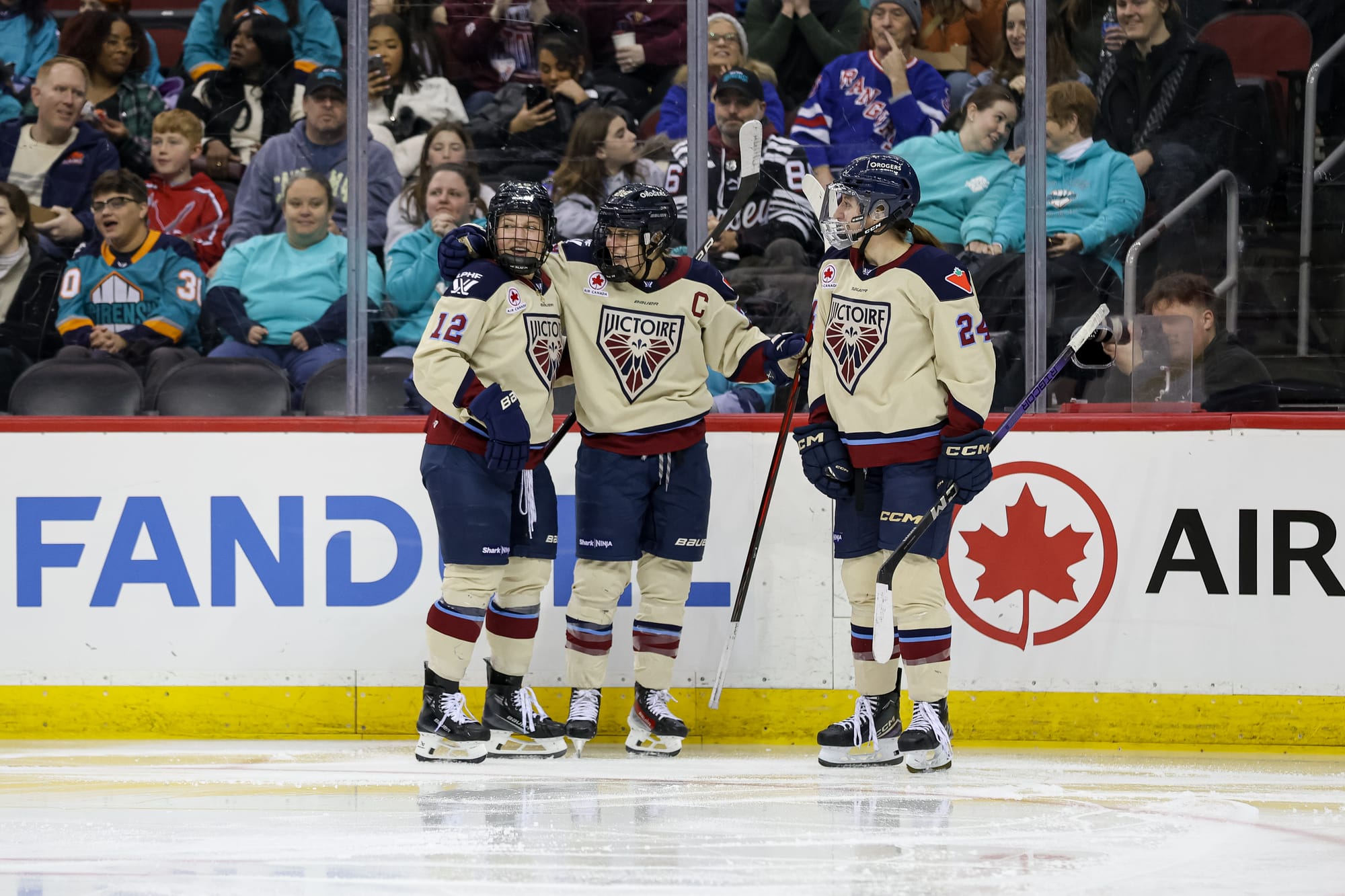 Jennifer Gardiner celebrates with teammates