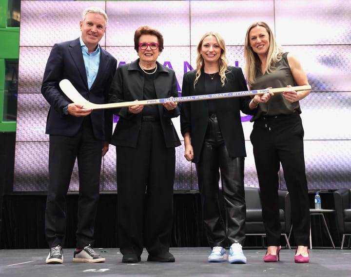 From left to right: Mike Hirshfeld, Billie Jean King, Savannah Harmon, and Jayna Hefford all pose on the PWHL draft stage.