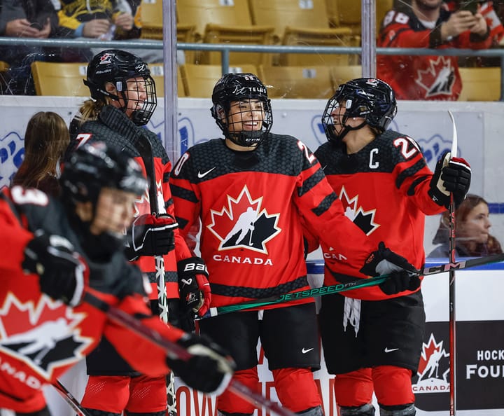 Laura Stacey, Sarah Nurse, and Marie-Philip Poulin of Team Canada smile during warmups (Photo Cred: Hockey Canada)