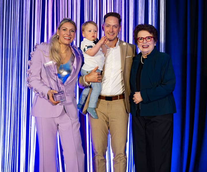 Natalie Spooner shows off her MVP Award with her family and Billie Jean King