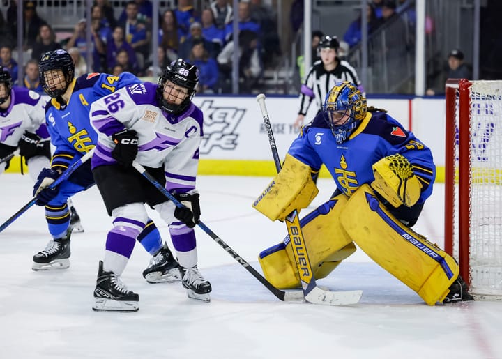 Kendall Coyne Schofield with Kristen Campbell looking at an on coming shot (Photo Cred: PWHL)